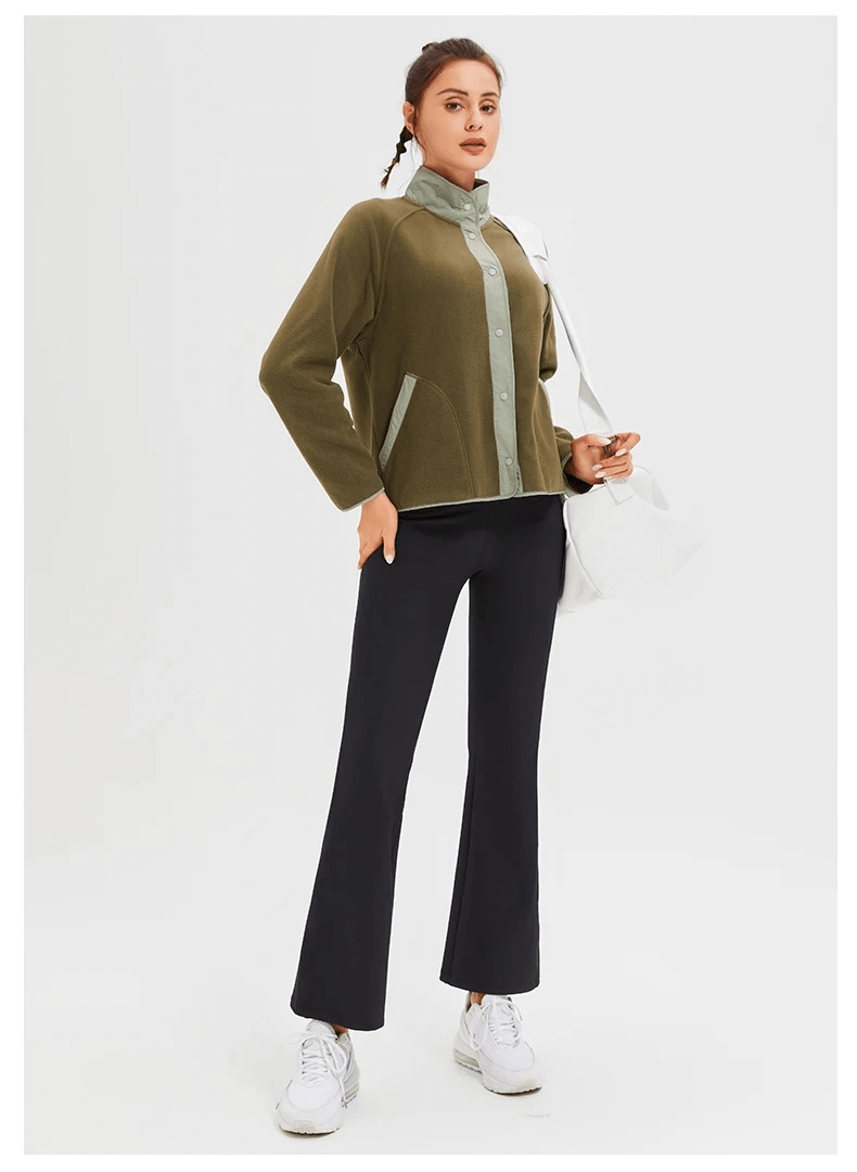 Woman wearing a stylish wool sports jacket SF2009, ideal for winter running, featuring a mandarin collar and windproof design.